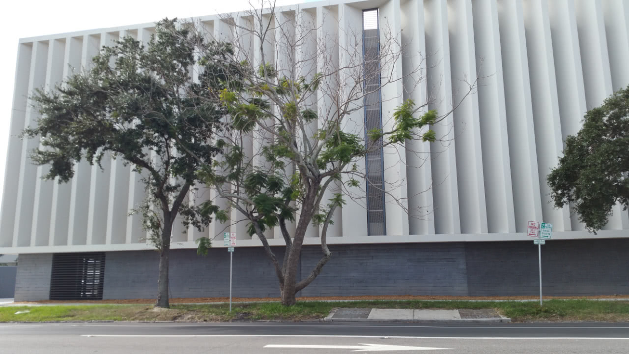 A white wall with tall vertical slats