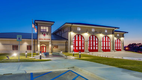 A tan fire place with red garage doors